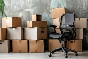 Office chair and boxes in an empty room photo