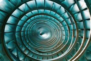 A blue spiral tunnel with a circular shape photo