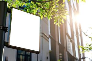 Blank billboard on a street corner photo
