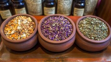 Three small bowls filled with herbs and spices photo