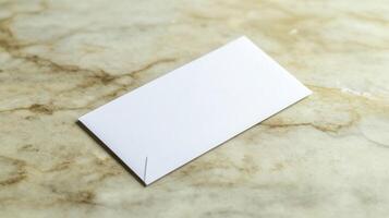 A white business card laying on a marble surface photo