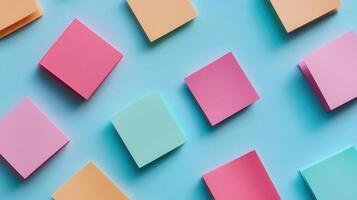 Colorful post-it notes on blue background photo