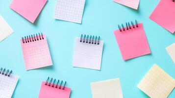 Many different colored sticky notes on a blue background photo
