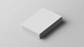 A stack of blank business cards on a white surface photo