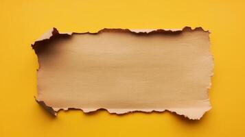 A piece of torn paper on a yellow background photo