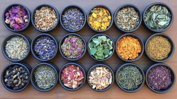 A variety of herbs and spices in black bowls photo