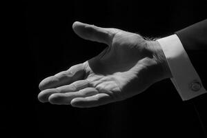 A black and white photo of a man's hand