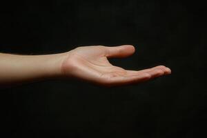 A hand reaching out to the sky photo
