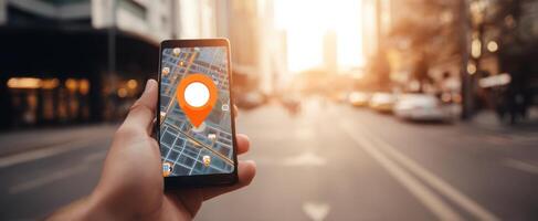 The smartphone displaying a map and location pin in an urban setting. photo