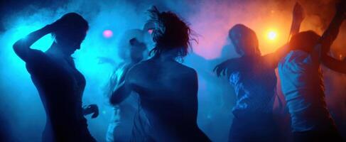 The vibrant dance scene illuminated by colorful lights and energetic movements. photo