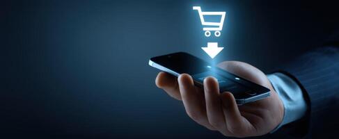 The smartphone with online shopping cart and digital purchase icon. photo