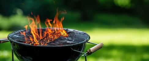 The charcoal grill with vibrant flames ready for summer cooking adventures photo