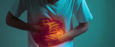 The human experience of abdominal pain and emotional struggle through hands. photo