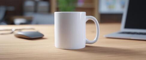 The white mug centered on a stylish wooden desk with modern technology photo