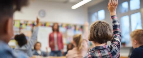The classroom scene with engaged students raising their hands to participate. photo