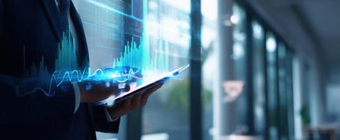 The business professional interacting with digital data visualization on a tablet. photo