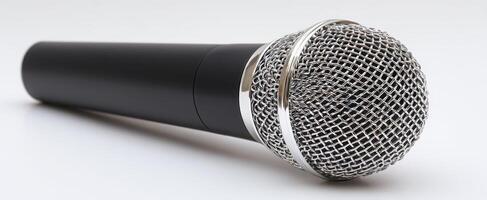 The microphone resting elegantly on a clean, white surface. photo