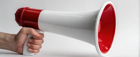 The megaphone in a person's hand for effective communication and announcements. photo