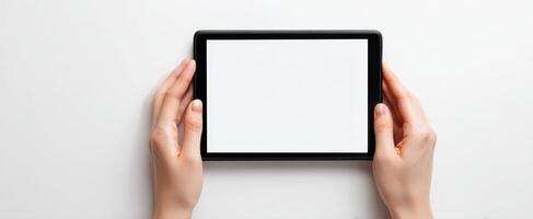 The tablet held in hands ready for creative design or mockup. photo
