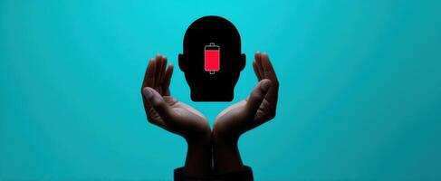 The silhouette of a head being recharged by supportive hands. photo