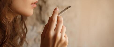 The woman enjoying a moment of contemplation while smoking a cigarette. photo