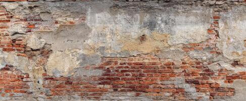 The weathered brick wall showcasing rustic industrial charm and character. photo