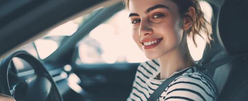 The smiling woman enjoying her drive in a modern car. photo