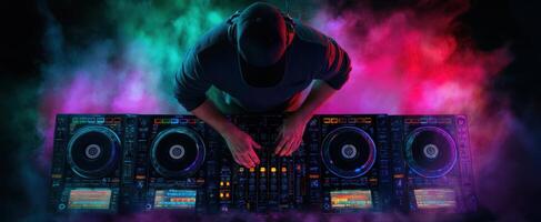 The DJ Creating Electric Vibes with Colorful Lights and Sound Effects photo