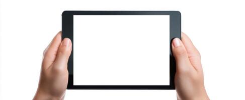 The hands holding a tablet displaying a blank screen for creative projects. photo