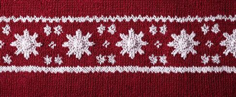 The Decorative Red Knitted Fabric with White Snowflake Patterns photo