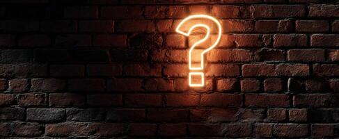 The Glowing Question Mark Against a Rustic Brick Wall photo