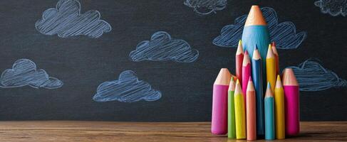 The colorful pencils arranged to form a vibrant artistic structure on a chalkboard. photo