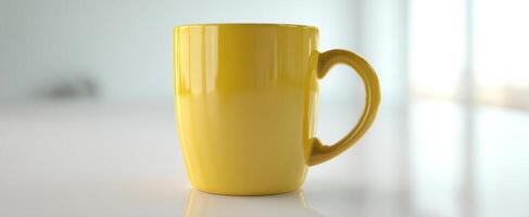 The vibrant yellow mug standing on a sleek, modern table. photo