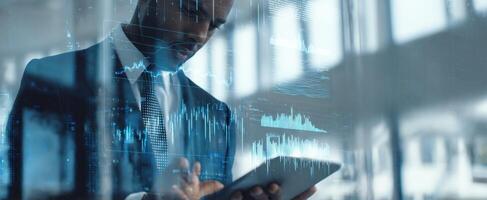 The businessman analyzing data on a tablet with modern financial graphics. photo