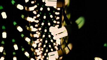 Brightly lit light bulbs create an enchanting atmosphere in a beautifully dark ambient setting video