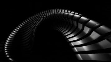 A Curved Metallic Structure that stands out against a Dark Background for visual appeal video