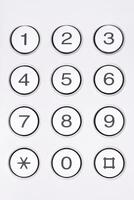 Round buttons with numbers close up photo