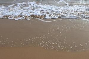 Water foam with smooth sand photo