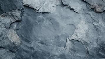Close-up view of textured grey stone surface showcasing natural formations and lines. Ideal for backgrounds, design concepts, or architectural studies requiring earthy, rugged textures. photo
