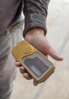 Craftsman hold in dusty hand horizontal rotary laser level device photo