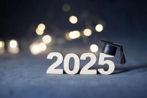 Class of 2025 concept. Wooden number 2025 with graduation hat with bokeh photo