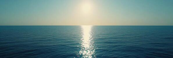 Tranquil photo banner capturing peaceful ocean surface with gentle sunlight reflections. Perfect for minimalist designs, wellness campaigns and serene nature visuals