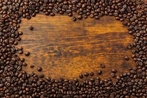 Rustic top view coffee bean frame layout with empty center for text or branding. concept symbolizing warmth, hospitality and culinary passion, perfect for advertising, banners and website headers photo