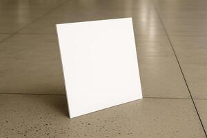 white square plate on the floor of an empty area photo