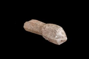 Macro of a stone, a scepter-like quartz mineral on a black background photo