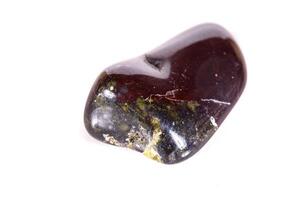 Macro mineral, stone jasper on a white background photo