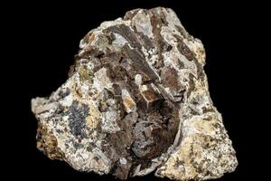 Macro stone mineral pyrite and quartz on a black background photo