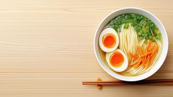 Overhead view of ramen bowl with chopsticks on bamboo placemat, with copy space photo