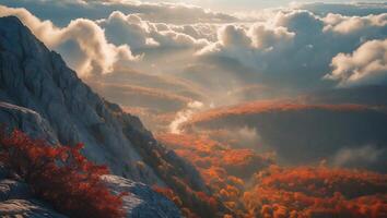 Mountain Peak Overlooking Autumn Forest with Clouds and Sunlight photo