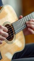Close-up of hands playing an acoustic guitar. photo